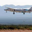 The rocket plane carrying Virgin Galactic founder Richard Branson and other crew members