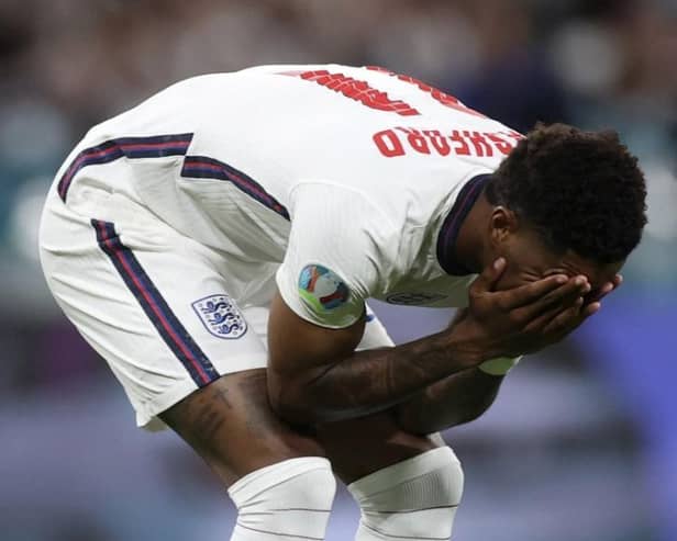 Marcus Rashford reacts after missing his penalty