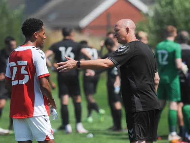Simon Grayson gives instructions to James Hill during the Poolfoot Farm friendly with Port Vale