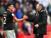 Lincoln boss Michael Appleton (right) celebrates winning through to last season's play-off final with Regan Poole