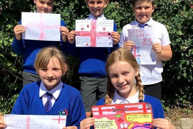 Year Five pupils Ben, Jaxson, Oliver, Lily and Ella with their letters of support to England players who were racially abused after the Euro 2020 final.