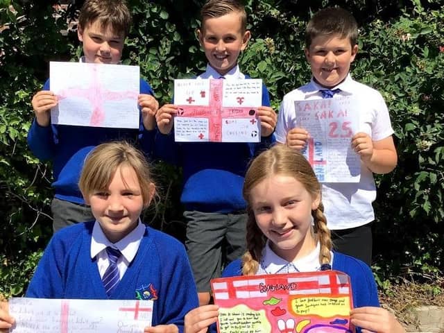 Year Five pupils Ben, Jaxson, Oliver, Lily and Ella with their letters of support to England players who were racially abused after the Euro 2020 final.