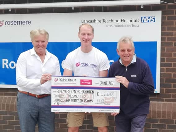 Paul Rotheram (left), also a corporate sponsor and the show’s auditor, and Ed Cook present Rosemere Cancer Foundation’s chief officer Dan Hill (centre) with the money raised by this year’s event