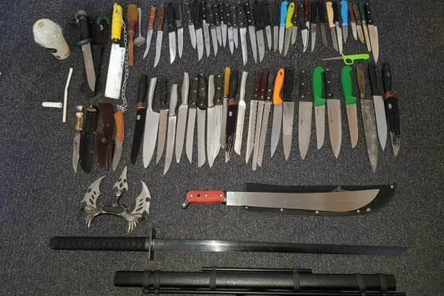63 knives - including a machete and a samurai sword - were recovered from a knife bin in Burnley. (Credit: Lancashire Police)