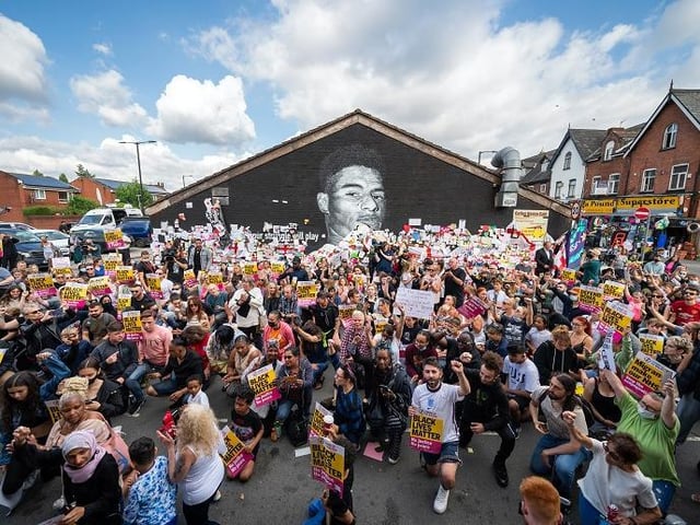 Police have said they do not think that abusive graffiti on the mural was of a racial nature