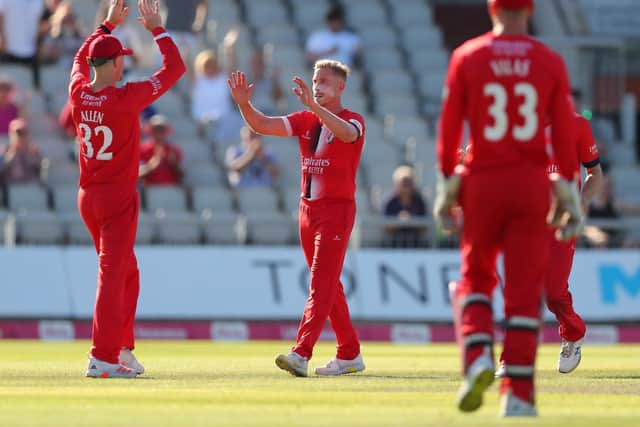 Lancashire's Luke Wood celebrates one of his four wickets