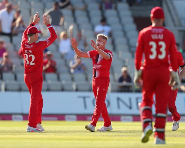 Lancashire's Luke Wood celebrates one of his four wickets