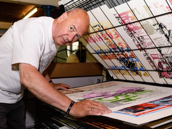 Robin Ross and his latest works for exhibition, a series of prints based around the works of artist Ray Lowry who captured The Clash on tour. Photo: Kelvin Stuttard