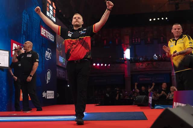 Defending champion Dimitri Van den Bergh defeated Dave Chisnall Picture: Lawrence Lustig/PDC