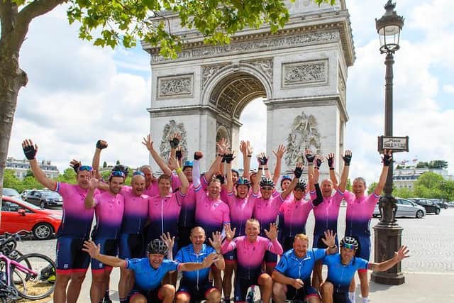 The team feel jubilant at the finish in Paris
