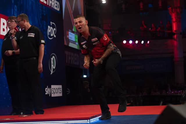 Nathan Aspinall faces Michael van Gerwen after beating Gary Anderson on Wednesday Picture: Lawrence Lustig/PDC