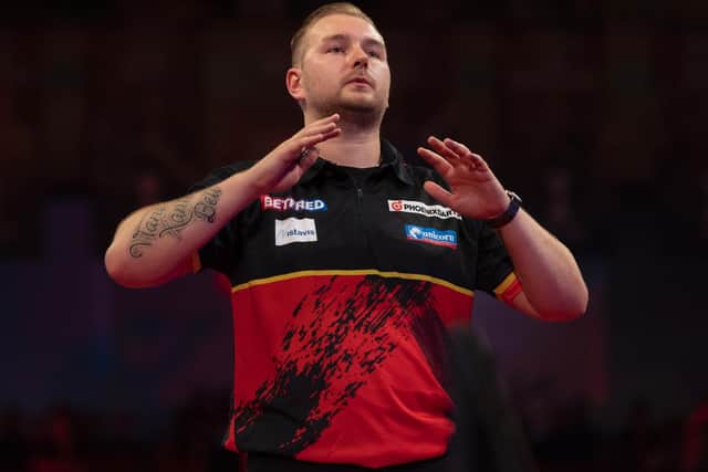 Dimitri Van den Bergh plays his semi-final at the Winter Gardens tonight Picture: Lawrence Lustig/PDC