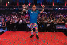 Betfred World Matchplay champion Peter Wright celebrates in front of a capacity crowd at Blackpool's Winter Gardens
