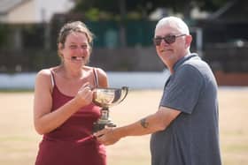 Ladies'  open singles champion Carol Darley receives her trophy from festival chairman Colin Newton