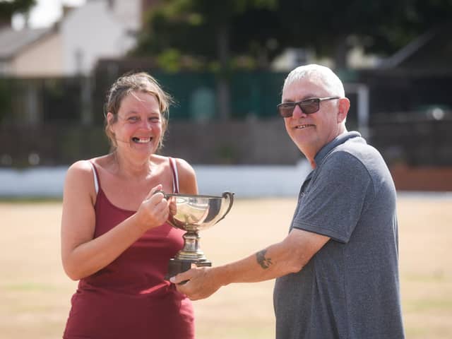 Ladies'  open singles champion Carol Darley receives her trophy from festival chairman Colin Newton
