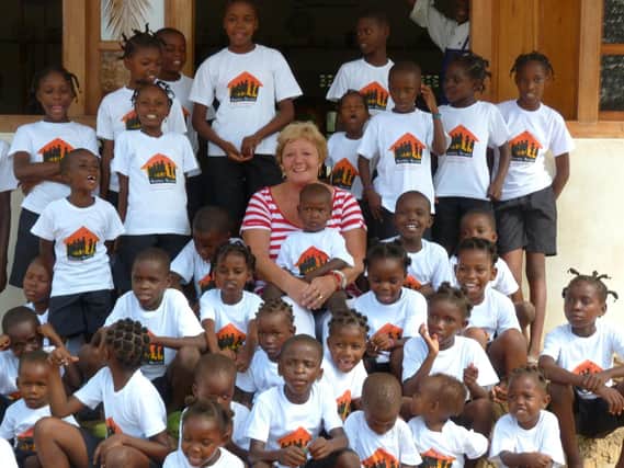 Sue Hayward with some of the children at the Happy House