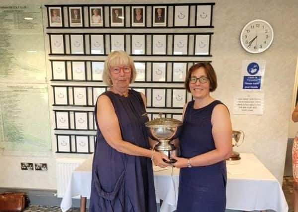 Fairhaven Lady Captain Pat Francis presents the Hilda Haynes Trophy to Vanessa Barrow