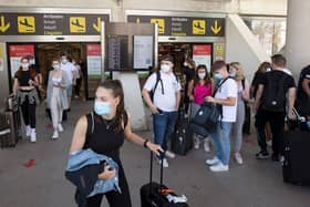 Tourists arrive at Son Sant Joan airport in Palma de Mallorca on June 28, 2021