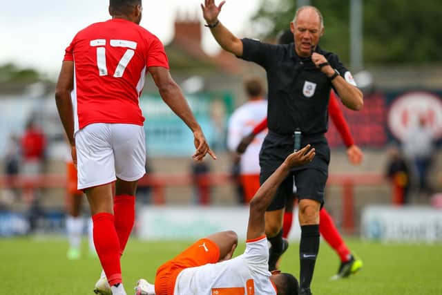 Mitchell goes down injured during yesterday's friendly against Morecambe