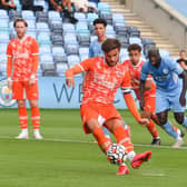 Luke Garbutt gets the Seasiders back on level terms from the penalty spot