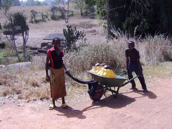 Water had to be carried in plastic bottles and a wheelbarrow before the bore holes were created
