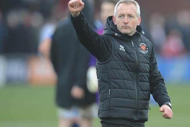 Neil Critchley salutes Blackpool fans before the draw at Fleetwood Town in March last year: his only game in front of the Seasiders' away fans