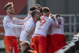 Blackpool's players celebrate their last-gasp equaliser