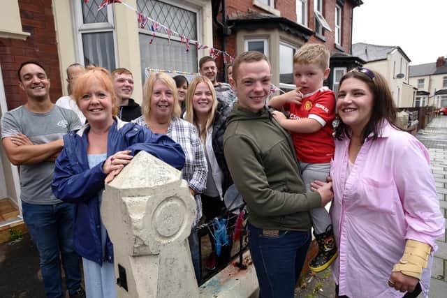 Jess Cook, right, with partner Jayson and son Oscar, was given a surprise homecoming welcome by pals. Picture: Paul Heyes Photography