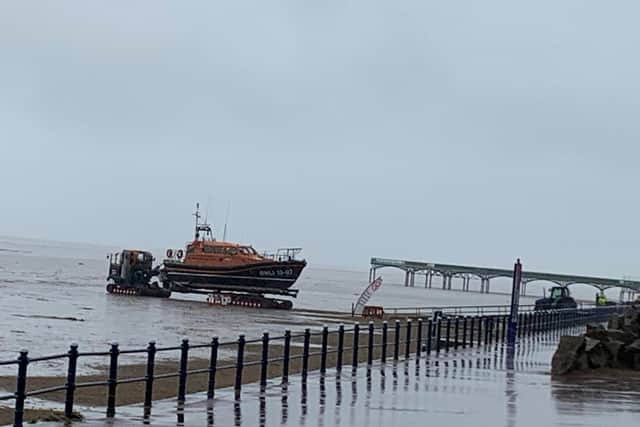 The relief Reg 13-09 lifeboat being launched by the SLRS tractor unit