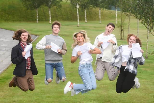 Students jump for joy as they celebrate outstanding A-level results. Pic: Daniel Martino, JPI Media