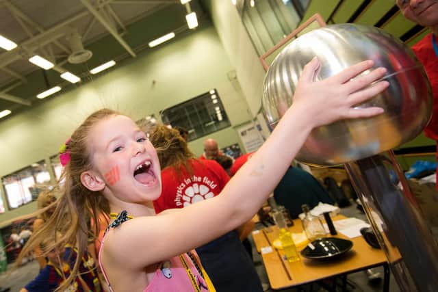 A young festival-goer enjoys the hands-on fun at a previous Lancashire Science Festival