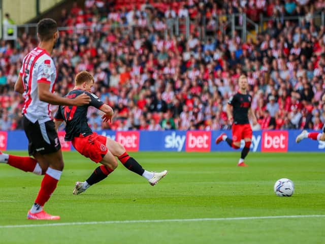 Ged Garner tries a shot for Fleetwood during the defeat at Lincoln