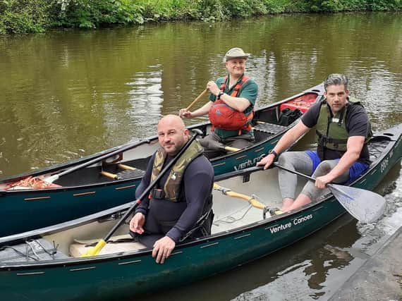 Rick Clement (left) in the canoe with Mark Harding, with Dave Seddon, a volunteer from Ribble Canoe Club, in the canoe behind them