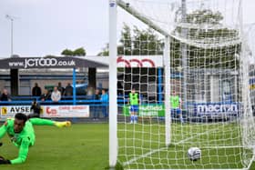 Nick Haughton scores from the penalty spot - one of AFC Fylde's four goals at Guiseley on Saturday