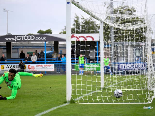 Nick Haughton scores from the penalty spot - one of AFC Fylde's four goals at Guiseley on Saturday