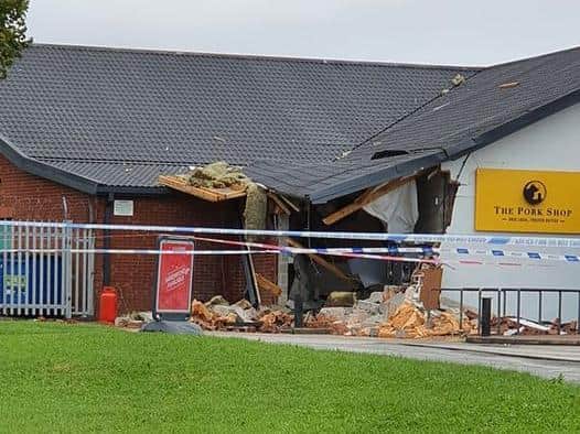 The surrounding wall and roof of the convenience store suffered significant damage in the blast. (Credit: Sophie Bagley)
