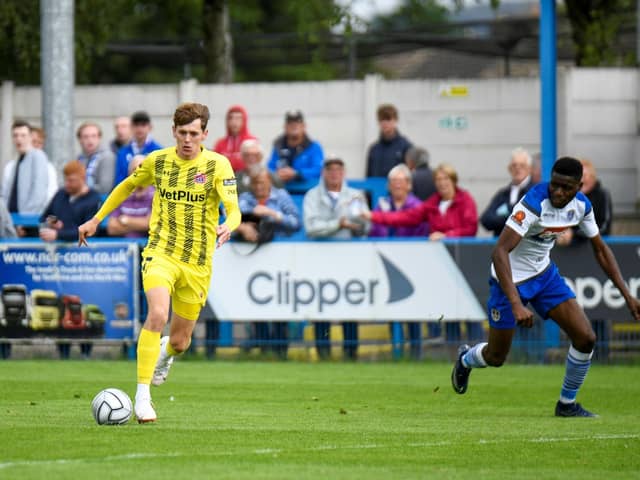 Ben Tollitt lines up a shot for the first of his two goals at Guiseley