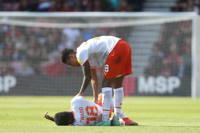 Tyreece John-Jules shows his concern for injured teammate Grant Ward at Bournemouth