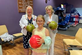 Coun Andrea Kay, Coun Lynne Bowen and Evie Abram play a game of bowling at one of Wyre Council's holiday clubs. Pic: Wyre Council