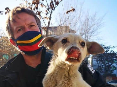 Paul ‘Pen’ Farthing, the founder of Nowzad animal rescue charity in Kabul, with a rescued dog. Pic: Nowzad/PA