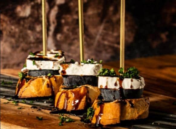 A typical pintxos from the Basque region of Spain, designed to be eaten while standing and socialising
