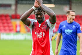 Darnell Johnson applauds the fans after playing his part in Fleetwood's first win of the season