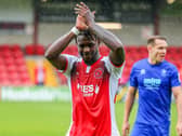 Darnell Johnson applauds the fans after playing his part in Fleetwood's first win of the season