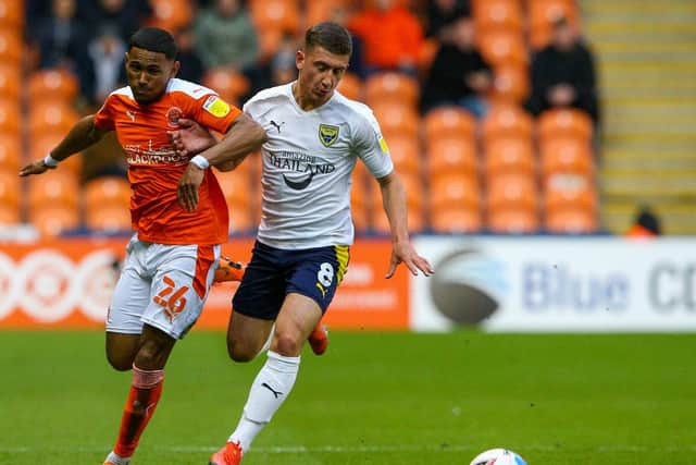 Brannagan in action against Blackpool during last season's play-offs