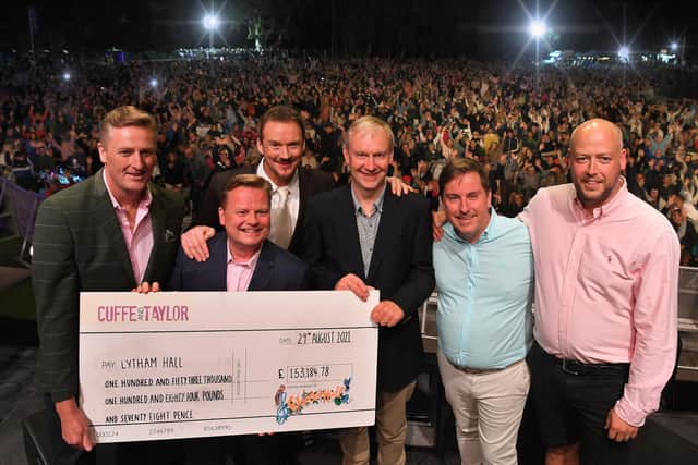 The money was presented to the Hall by Cuffe and Taylor on stage at the Russell Watson concert