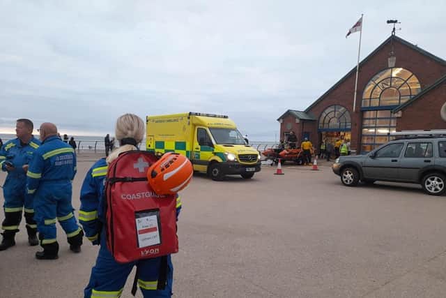 After their rescue, the two people were passed into the care of ambulance crews to be checked over. Pic: HM Coastguard Lytham