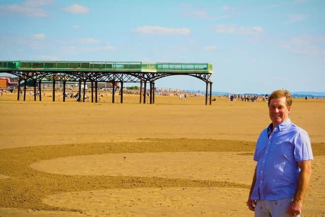Coun Tommy Threlfall at the scene of the art on St Annes beach