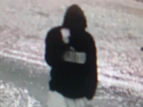 Blackpool CID say the man, seen on CCTV wearing a black hooded Puma top and grey joggers, is believed to be responsible for an assault in Elm Court, off Garstang Road West, on Thursday, May 6. Pic: Lancashire Police