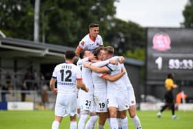 Fylde celebrate Joe Piggott's winning goal against Southport