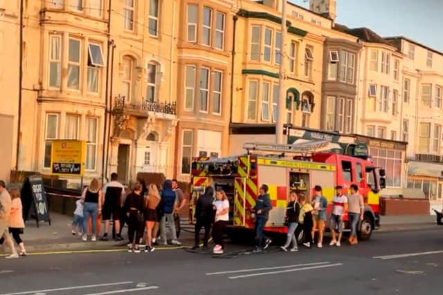 The incident drew a crowd of onlookers, with customers from The Manchester pub next door watching the event unfold. Pic: Mark Harper